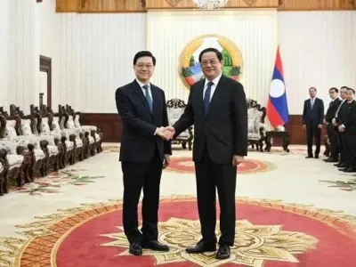 李家超率团访问老挝 双方签署12份备忘录加强合作