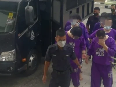 马来西亚83男女涉线上诈骗活动被捕案：其中7名中国男女在移民法被控